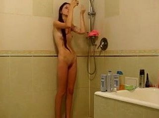 Skinny chick under the shower
